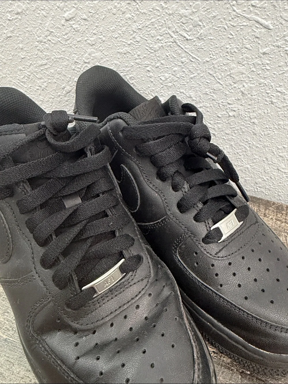 Nike Men's All-Black Leather Low-Top Sneakers